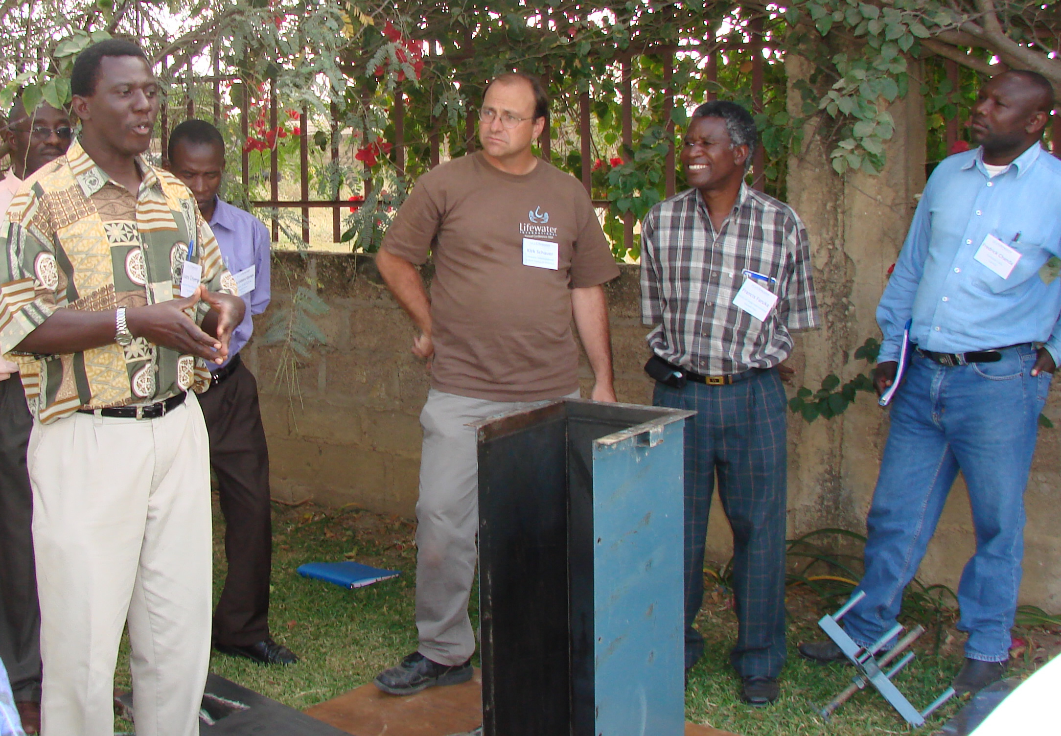 Evans Chiyenge, Kirk Schauer and Francis Feruka Train in Sand filters